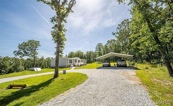 73.6 Acres of Land with Home for Sale in Yukon, Missouri