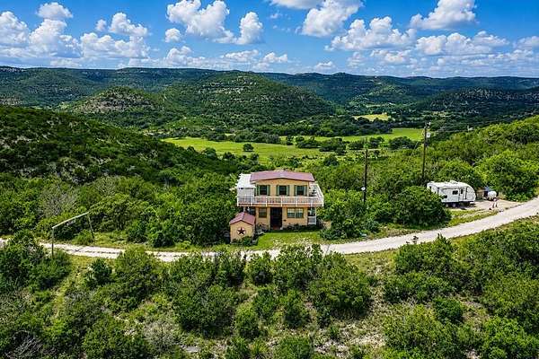5.73 Acres of Land with Home for Sale in Camp Wood, Texas