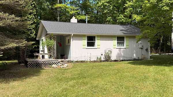 3.28 Acres of Land with Home for Sale in Kewadin, Michigan