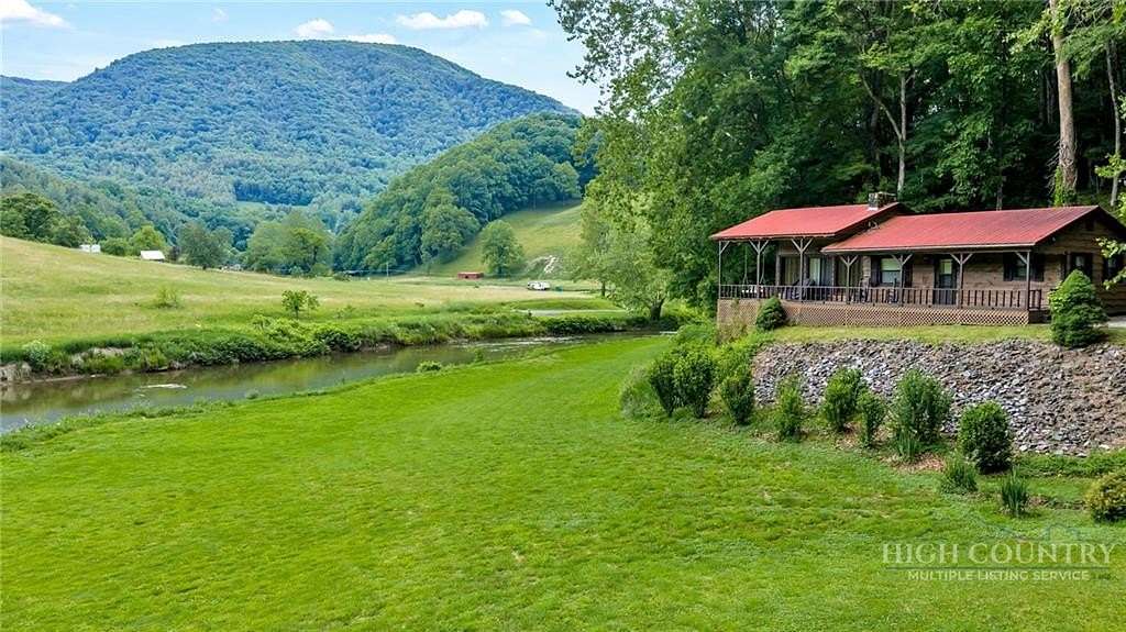 3.12 Acres of Land with Home for Sale in Lansing, North Carolina