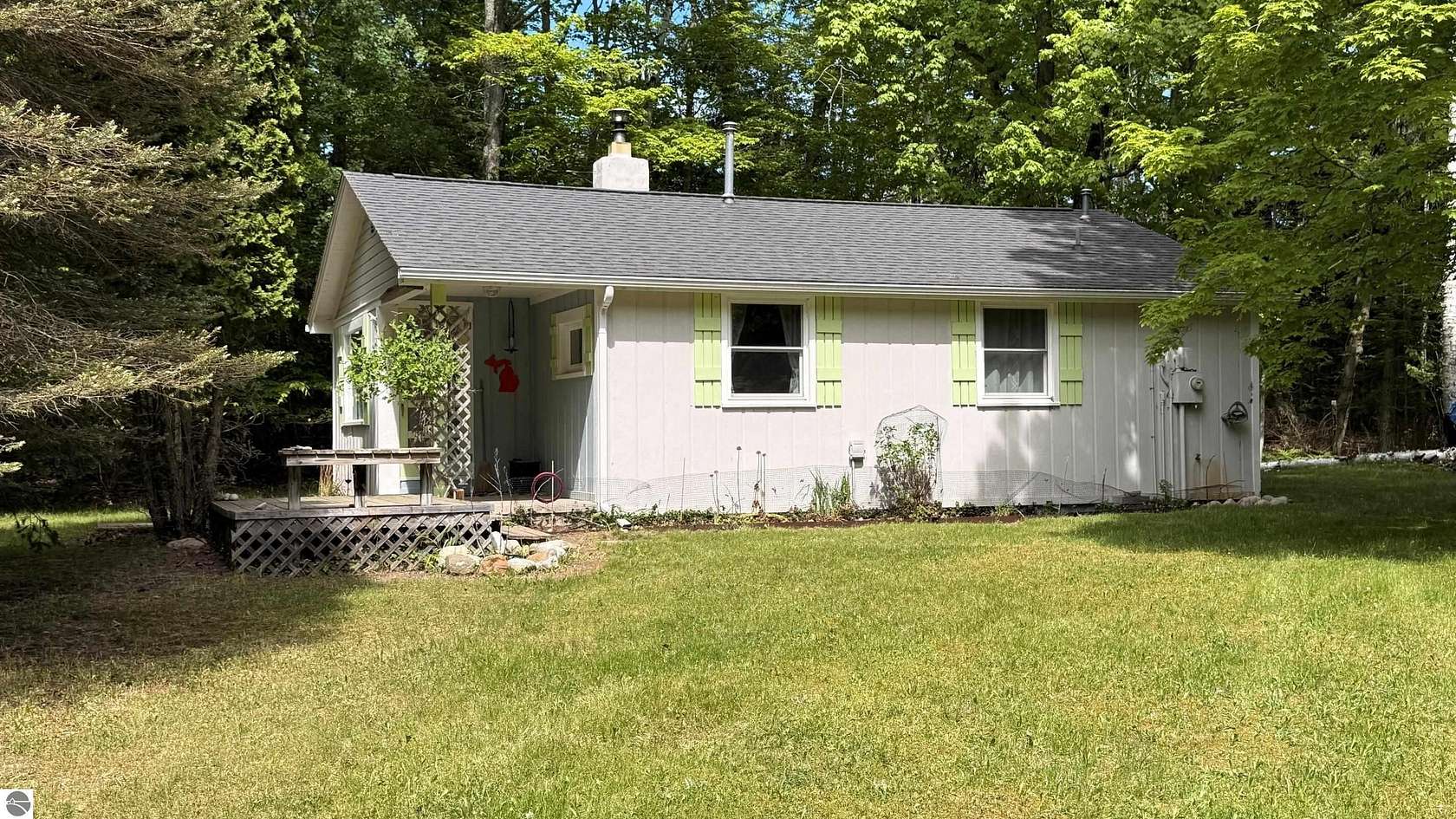 3.28 Acres of Land with Home for Sale in Kewadin, Michigan