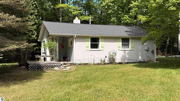 3.28 Acres of Land with Home for Sale in Kewadin, Michigan