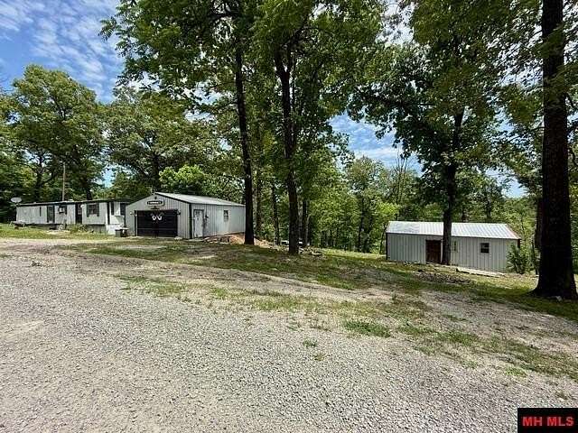 7.15 Acres of Land with Home for Sale in Mountain Home, Arkansas
