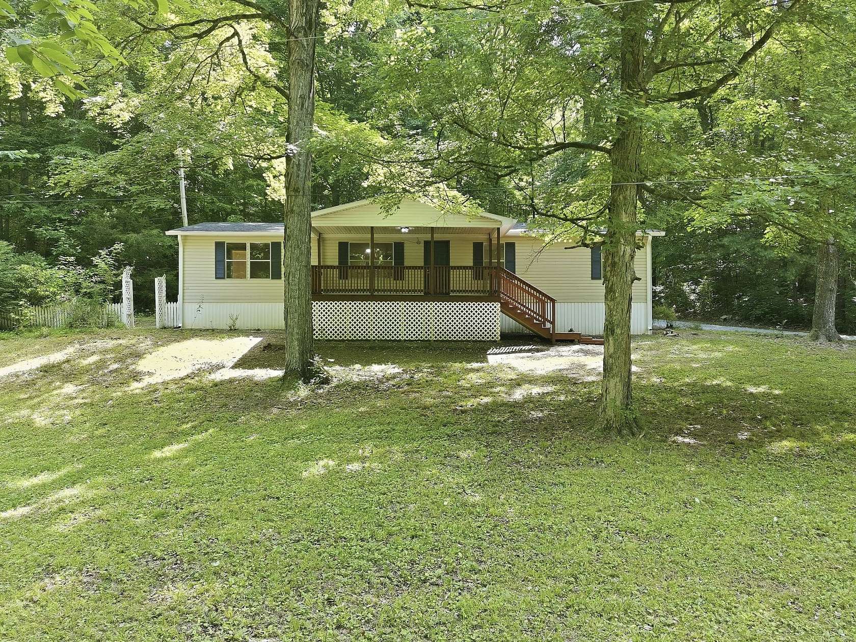16.4 Acres of Recreational Land with Home for Sale in McEwen, Tennessee