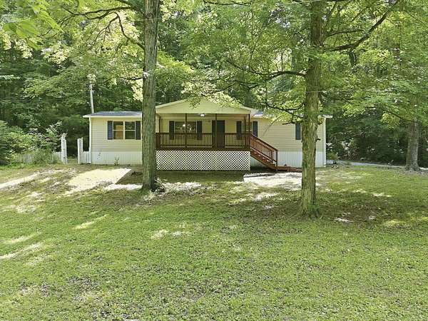 16.4 Acres of Recreational Land with Home for Sale in McEwen, Tennessee