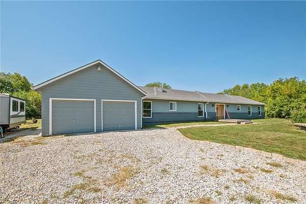 7.67 Acres of Land with Home for Sale in Peculiar, Missouri