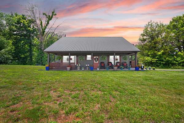 35.3 Acres of Land with Home for Sale in Canmer, Kentucky