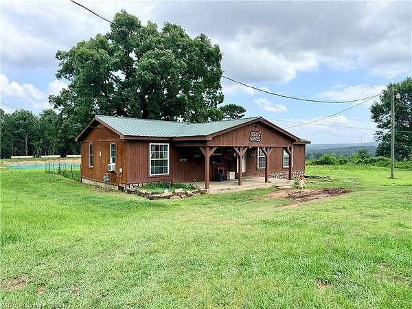 2.3 Acres of Land with Home for Auction in Booneville, Arkansas