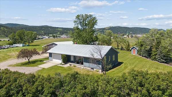 5 Acres of Land with Home for Sale in Kalispell, Montana