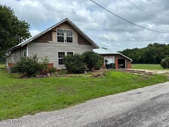 7.4 Acres of Land with Home for Sale in Purcell, Missouri