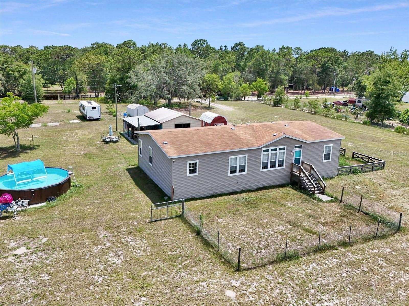 2.37 Acres of Land with Home for Sale in Spring Hill, Florida
