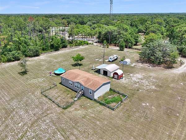 2.37 Acres of Land with Home for Sale in Spring Hill, Florida