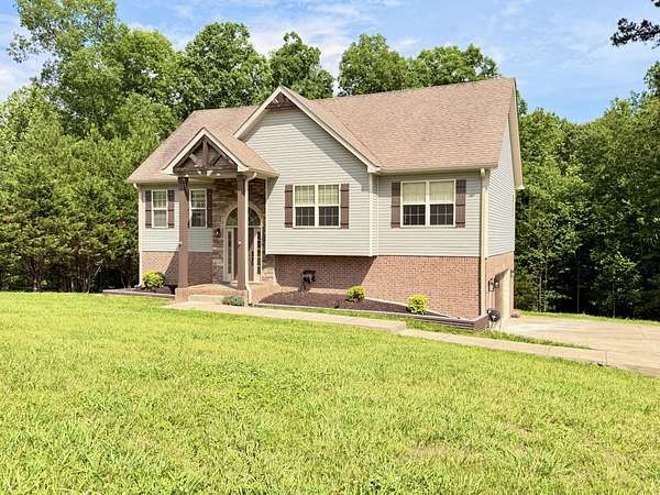 1.5 Acres of Land with Home for Sale in Cunningham, Tennessee