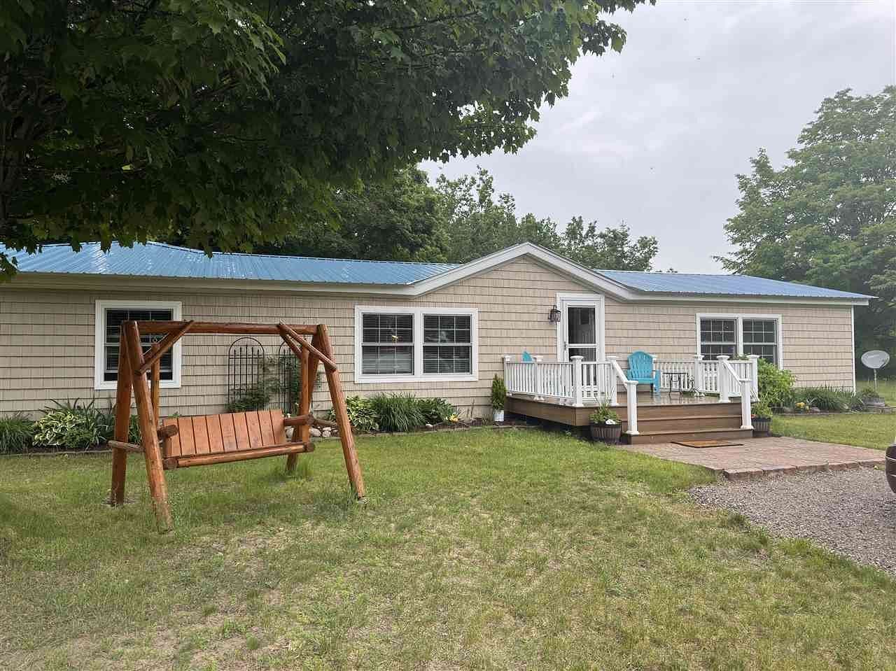2.54 Acres of Land with Home for Sale in Carp Lake, Michigan