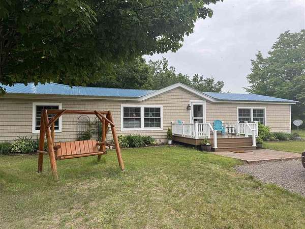 2.54 Acres of Land with Home for Sale in Carp Lake, Michigan