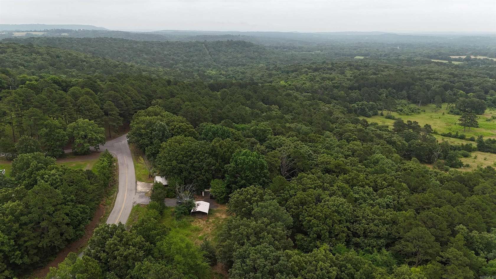 6.4 Acres of Land with Home for Sale in Clarksville, Arkansas