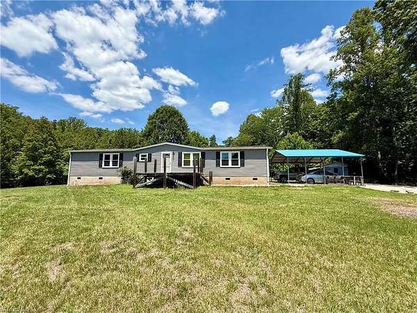 8.73 Acres of Land with Home for Sale in Stoneville, North Carolina