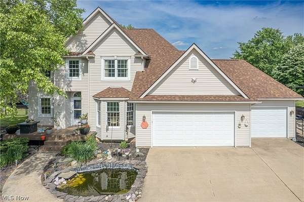 6.56 Acres of Land with Home for Sale in Louisville, Ohio