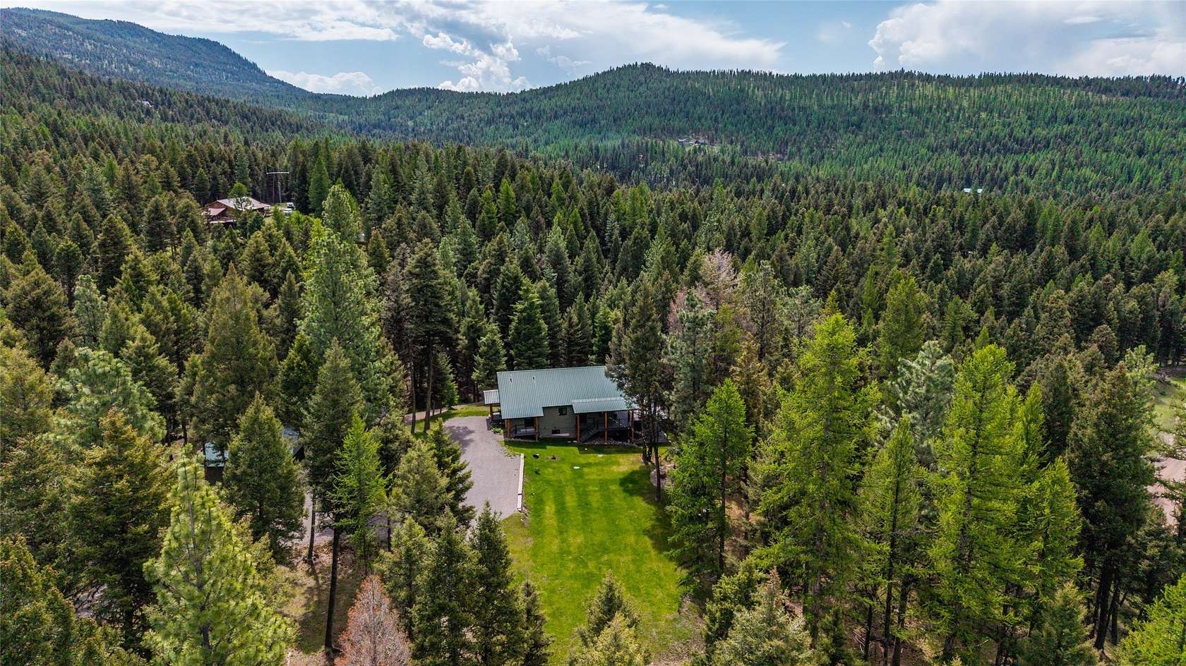 5.52 Acres of Land with Home for Sale in Seeley Lake, Montana