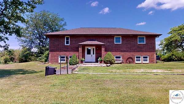 10.6 Acres of Land with Home for Sale in Knob Noster, Missouri