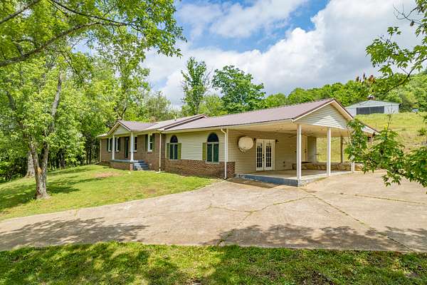6.79 Acres of Land with Home for Sale in Hampshire, Tennessee