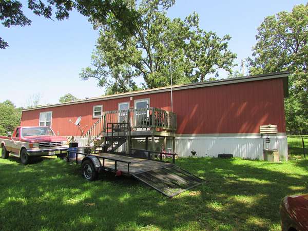 5.28 Acres of Land with Home for Sale in Grovespring, Missouri