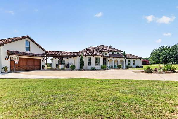 9.58 Acres of Land with Home for Sale in Millsap, Texas