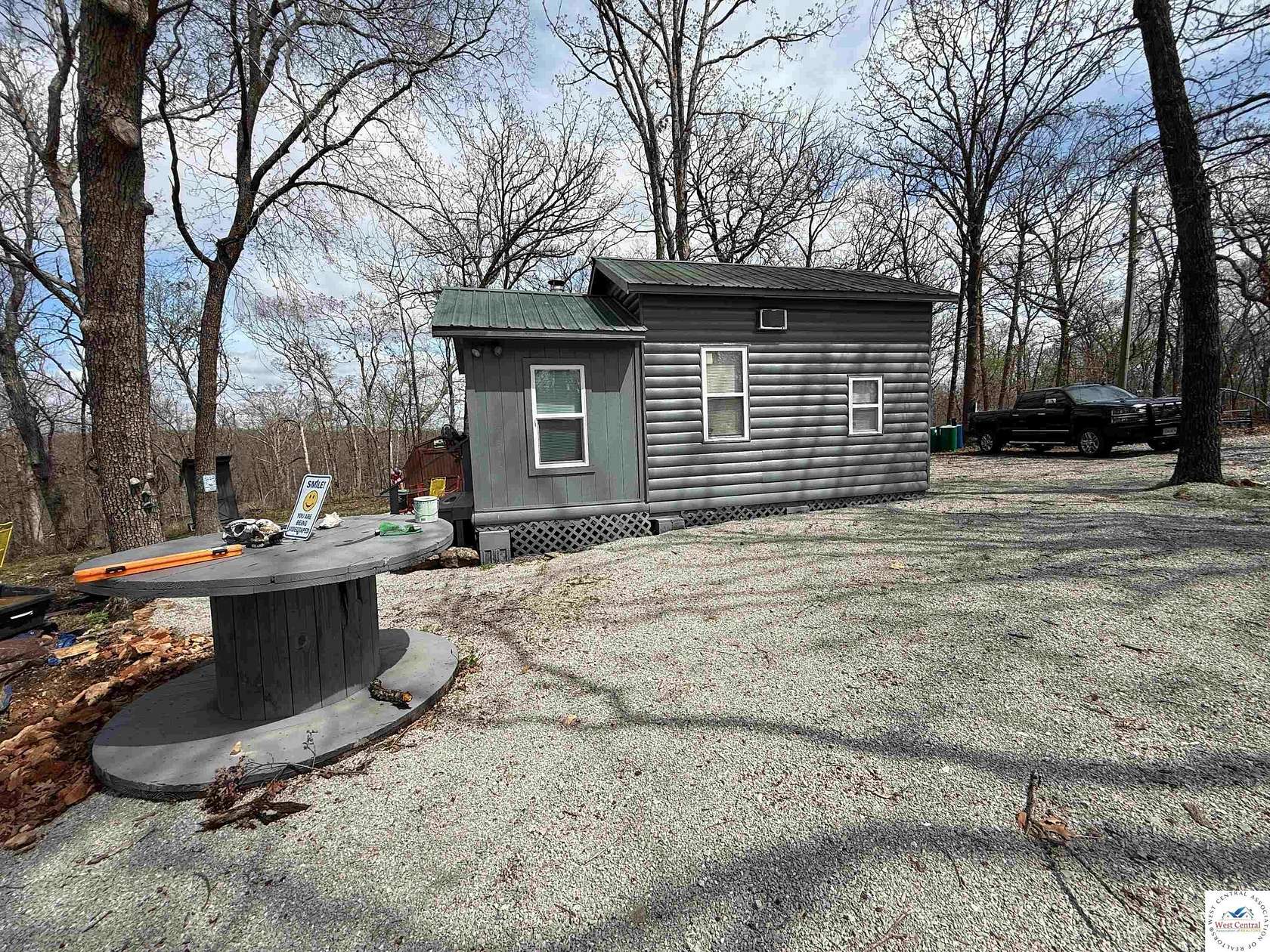 54.9 Acres of Recreational Land with Home for Sale in Deepwater, Missouri