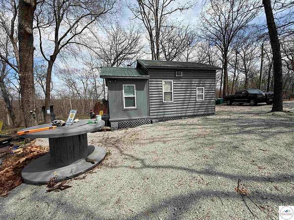 54.9 Acres of Recreational Land with Home for Sale in Deepwater, Missouri