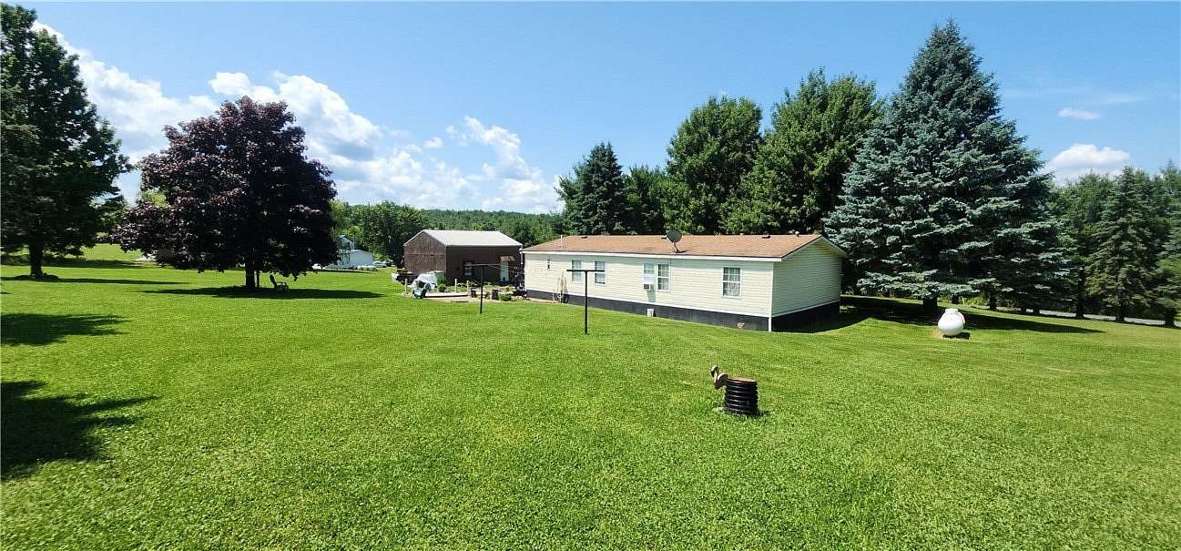 1.8 Acres of Land with Home for Sale in Newfield, New York