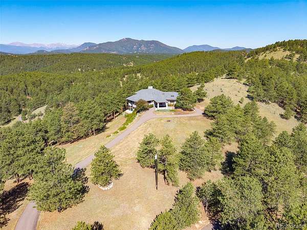 13.5 Acres of Land with Home for Sale in Evergreen, Colorado