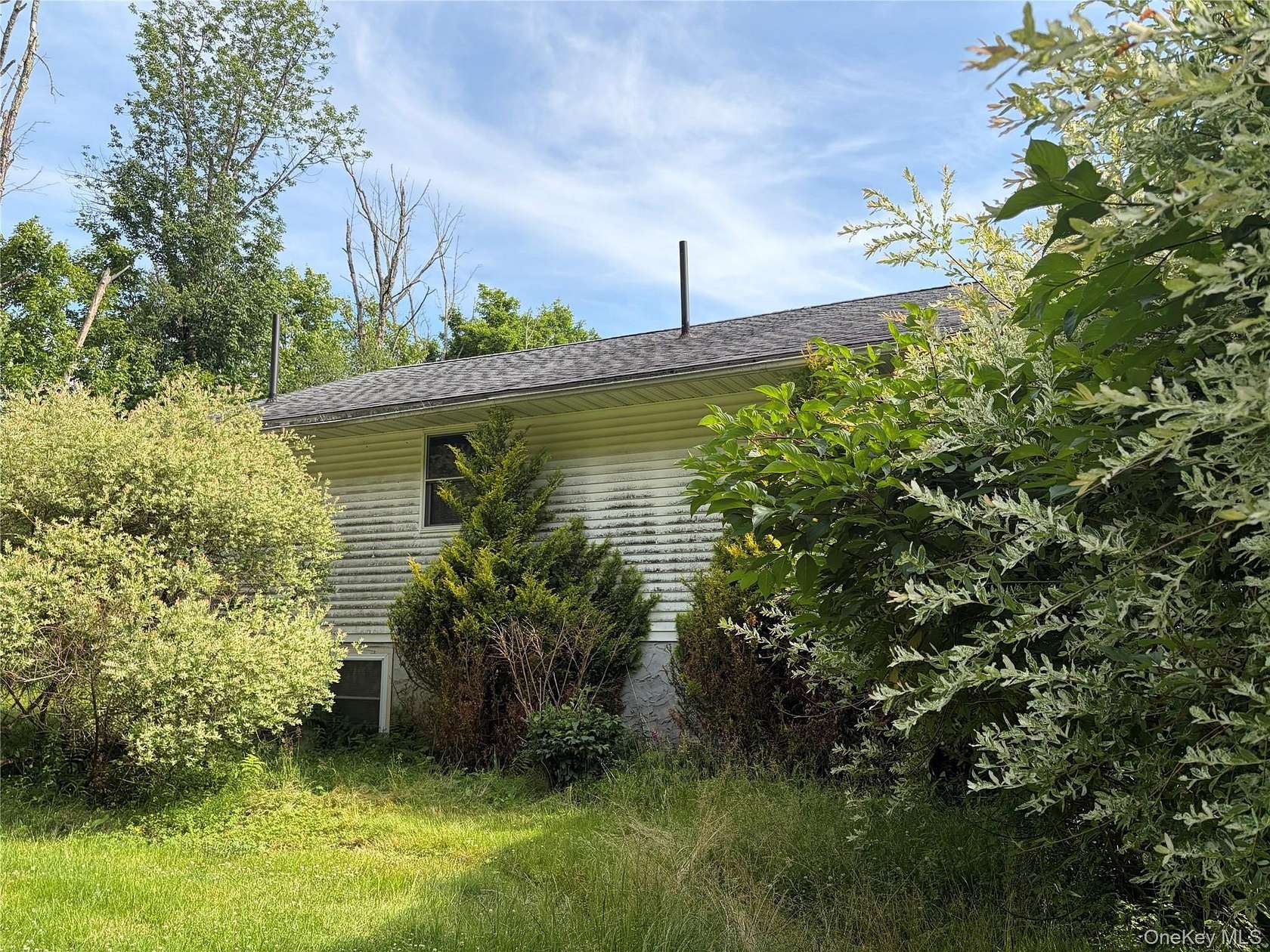 2.64 Acres of Land with Home for Sale in Swan Lake, New York