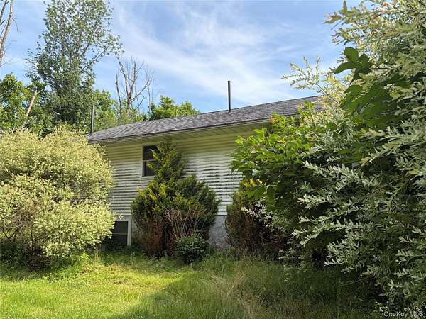 2.64 Acres of Land with Home for Sale in Swan Lake, New York
