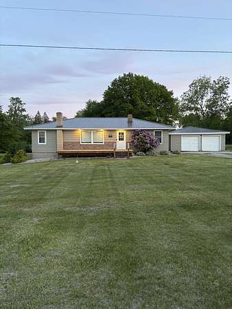 6 Acres of Land with Home for Sale in Lakeview, Michigan