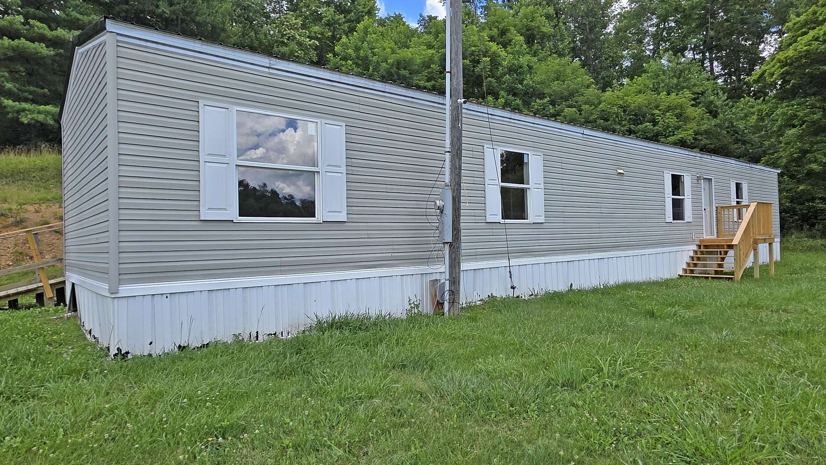 6 Acres of Land with Home for Sale in Booneville, Kentucky