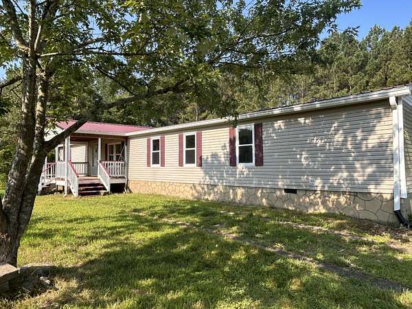 6.37 Acres of Land with Home for Sale in Oldfort, Tennessee