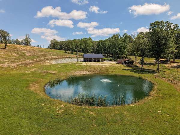 247 Acres of Recreational Land with Home for Sale in Big Sandy, Tennessee