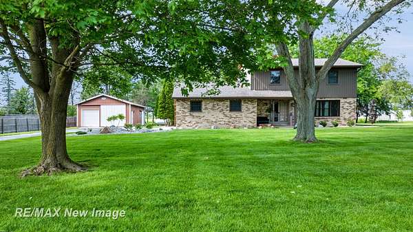 1.5 Acres of Land with Home for Sale in Freeland, Michigan