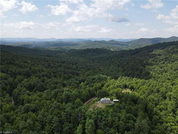 5.34 Acres of Land with Home for Sale in Purlear, North Carolina