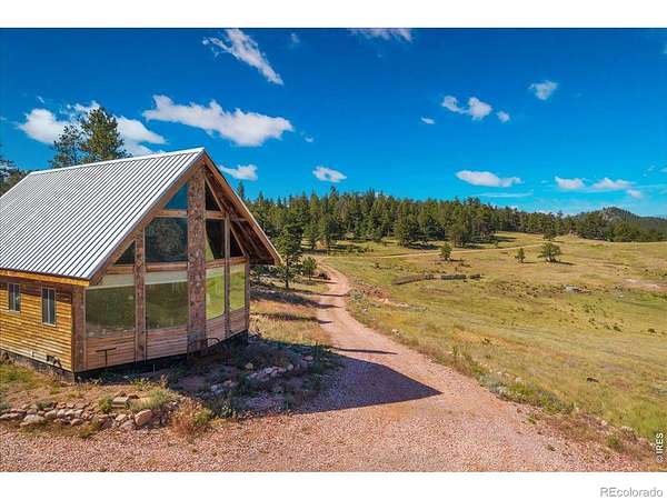 35 Acres of Recreational Land with Home for Sale in Red Feather Lakes, Colorado
