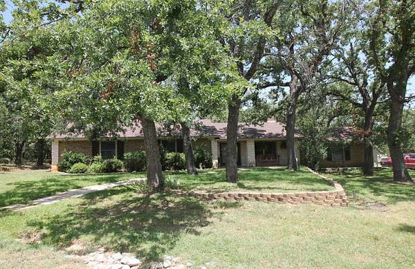 1.83 Acres of Land with Home for Sale in Runaway Bay, Texas
