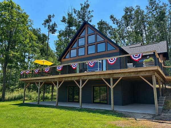 4 Acres of Land with Home for Sale in Hubbard Lake, Michigan