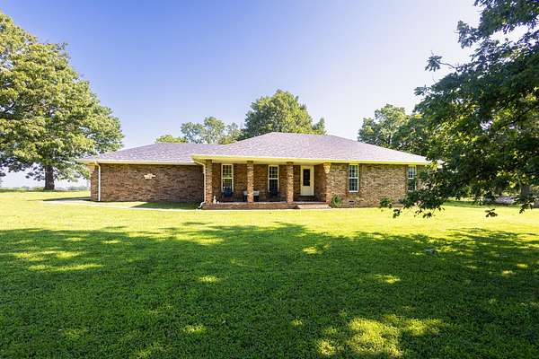 21.2 Acres of Land with Home for Sale in Crane, Missouri