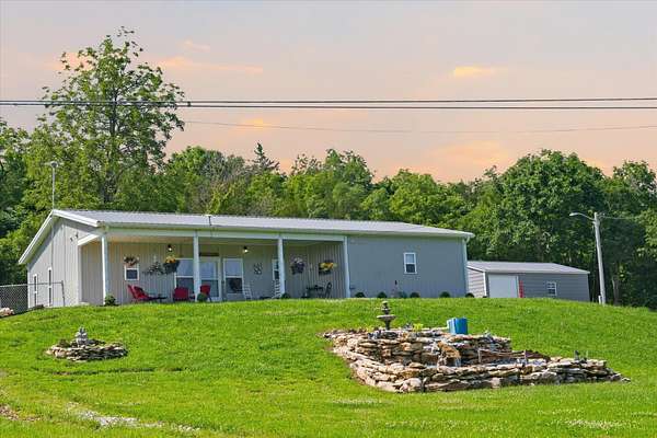 7.84 Acres of Land with Home for Sale in Weaubleau, Missouri