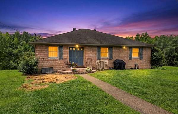 10 Acres of Land with Home for Sale in Slaughters, Kentucky
