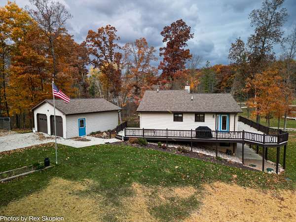 17 Acres of Recreational Land with Home for Sale in Sand Lake, Michigan