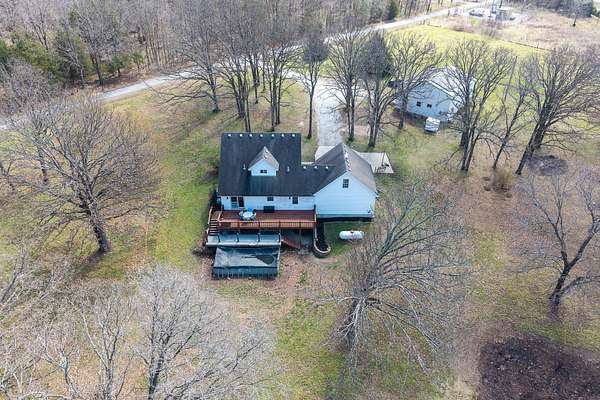 5.54 Acres of Land with Home for Sale in Humansville, Missouri