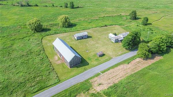 26.1 Acres of Land with Home for Sale in Three Mile Bay, New York
