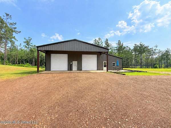 15.9 Acres of Land with Home for Sale in Gore Springs, Mississippi