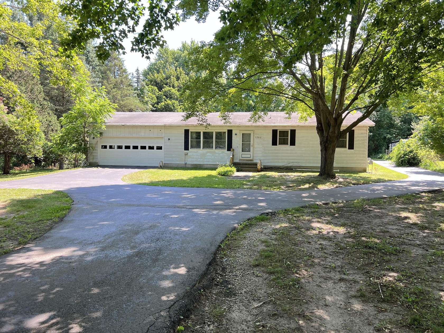 2.66 Acres of Land with Home for Sale in Rockford, Michigan